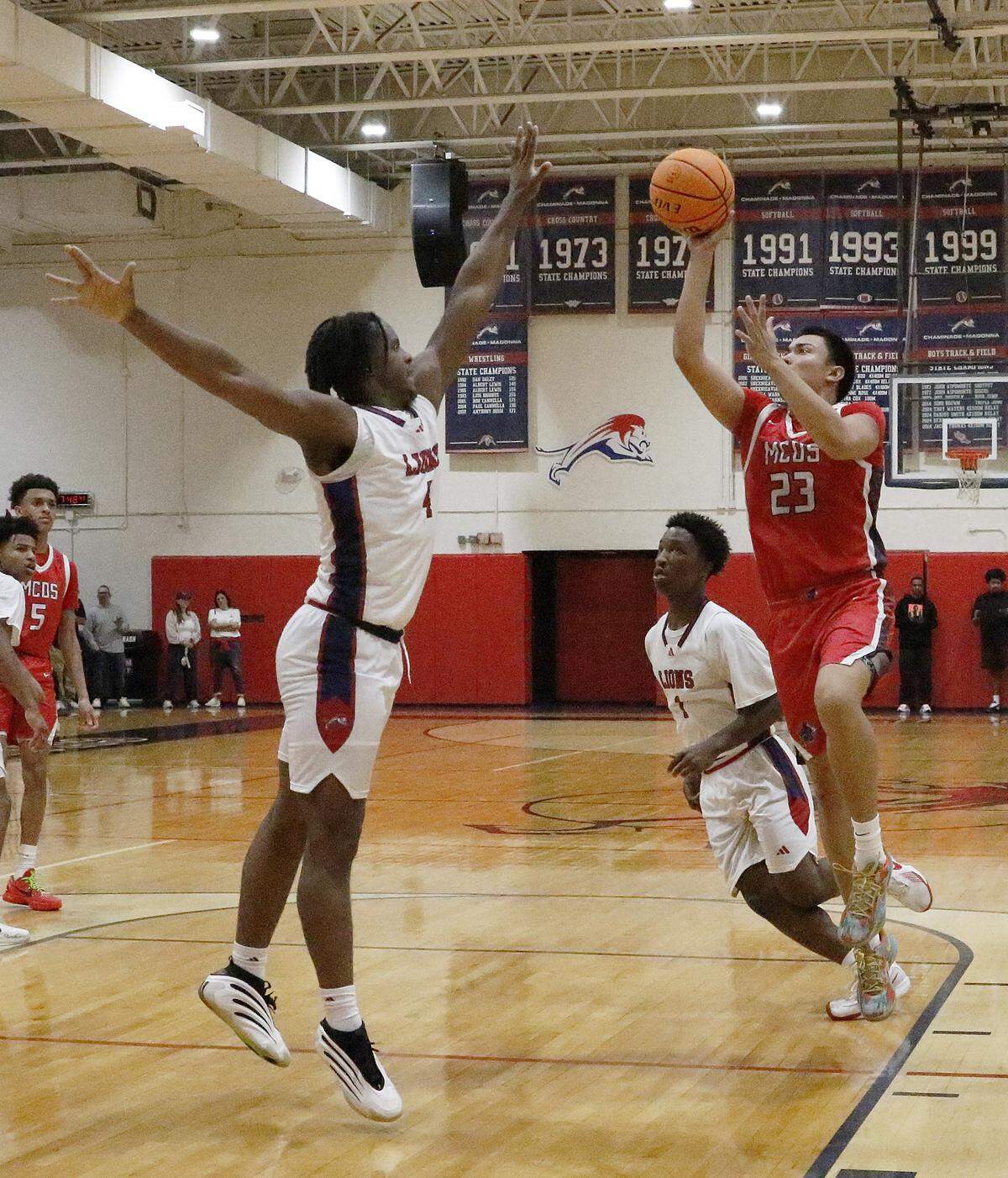Miami Country Day Spartans Fernando Romero (23) shoots against Chaminade-Madonna Lions during the Region 4-2A quarterfinal boys basketball game on Saturday, February 14, 2026 at Chaminade-Madonna School in Hollywood. Andrew Uloza / for Miami Herald