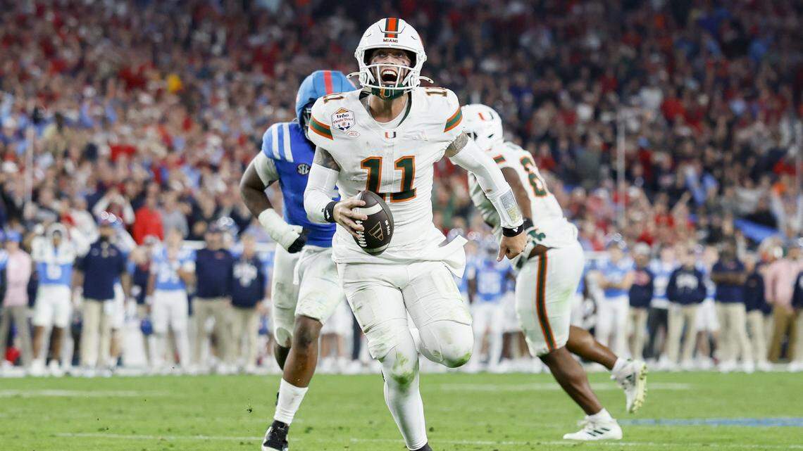 Miami Hurricanes quarterback Carson Beck (11) runs in to score during the second half of a College Football Playoff semifinal against the Mississippi Rebels in the Fiesta Bowl at State Farm Stadium on Friday, January 9, 2026 in Glendale, Arizona.
