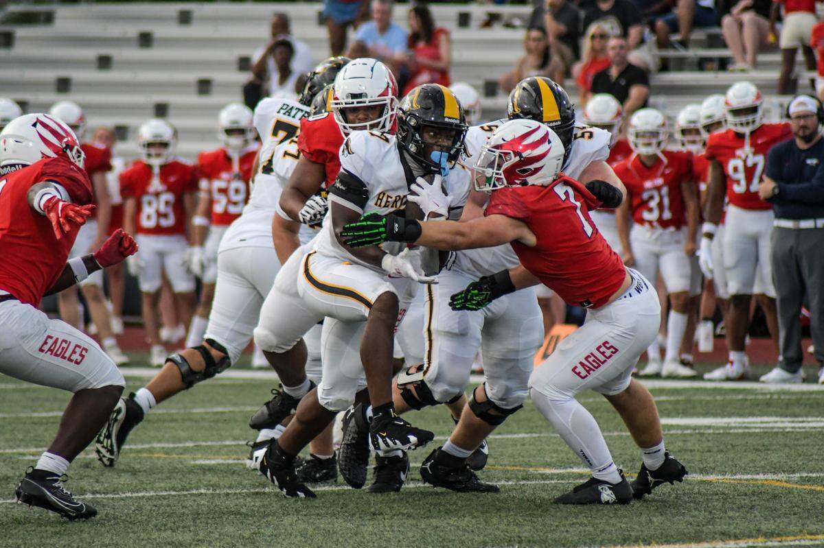 American Heritage running back Byron Louis carries the ball against Milton on Friday, Aug. 23, 2024, in a Broward County High School National Football Showcase game at St. Thomas Aquinas in Fort Lauderdale, Florida.