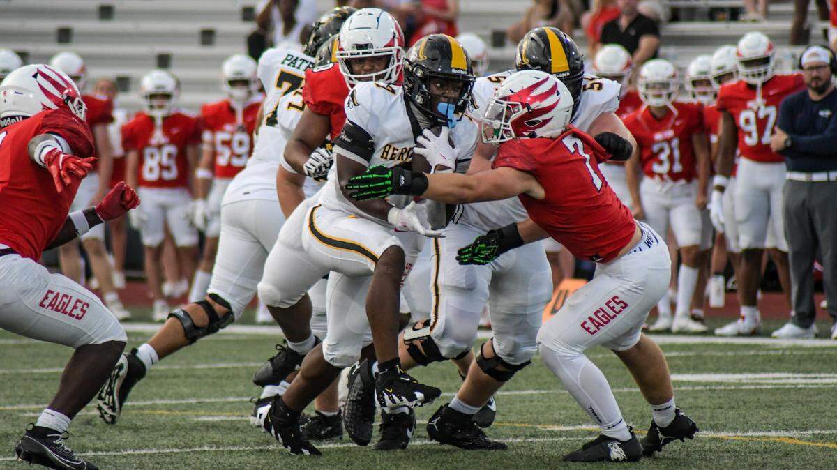 American Heritage running back Byron Louis carries the ball against Milton on Friday, Aug. 23, 2024, in a Broward County High School National Football Showcase game at St. Thomas Aquinas in Fort Lauderdale, Florida.