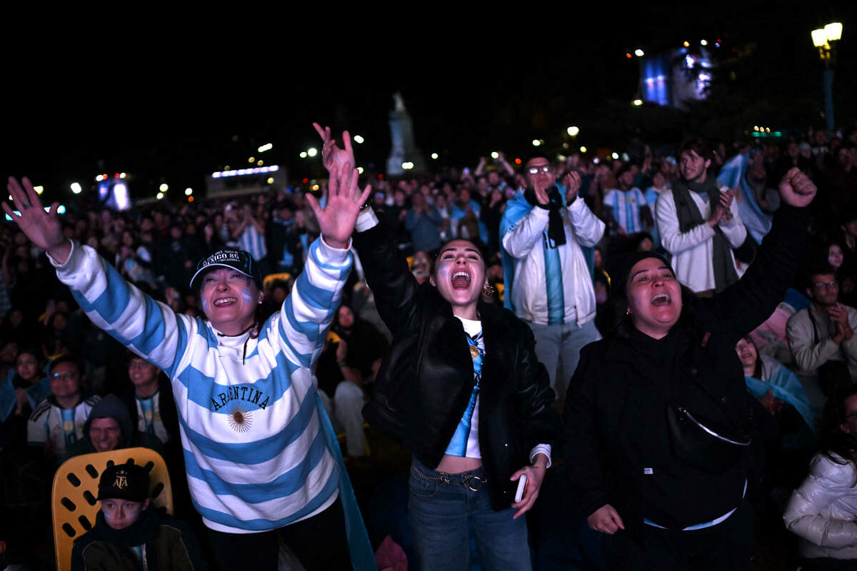 Argentina fans celebrate a goal scored by Argentina's forward Lionel Messi during the 2026 FIFA World Cup Group J football match between Argentina and Algeria as they watch it on a giant screen in Buenos Aires on June 16, 2026. (Photo by Luis ROBAYO / AFP via Getty Images)