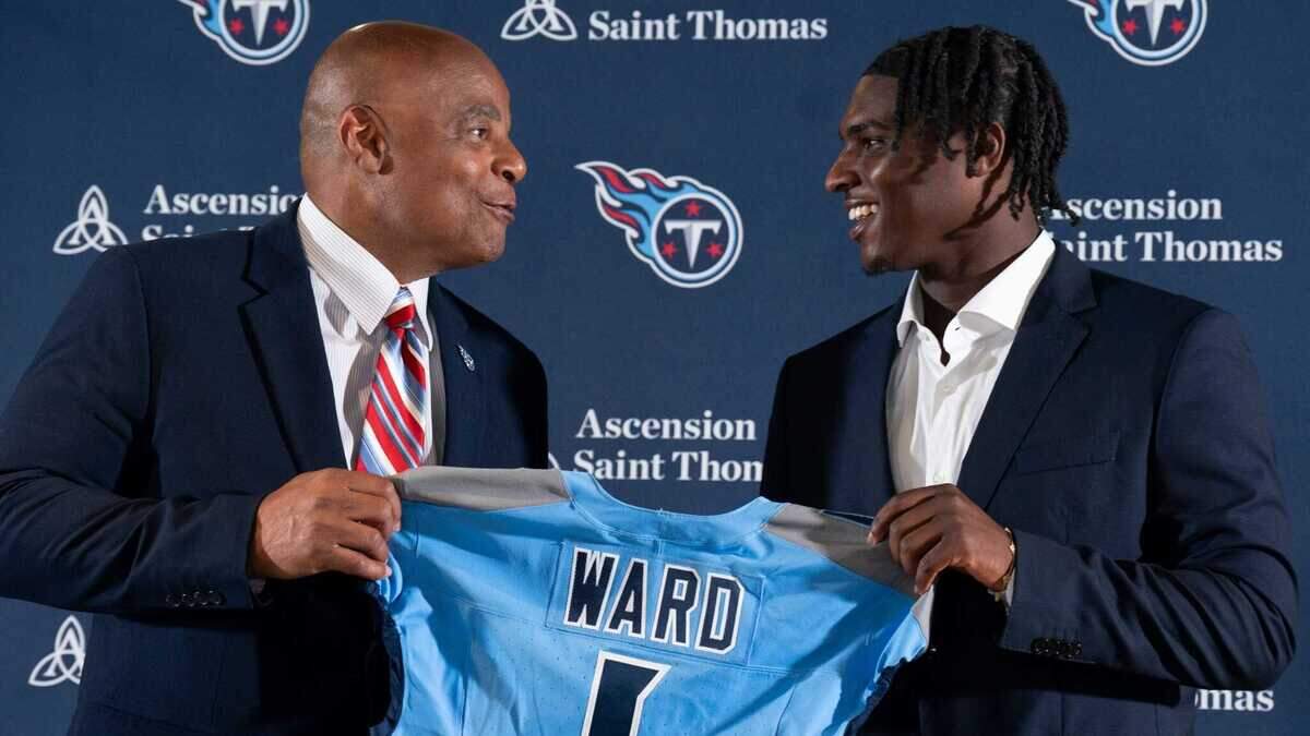 NFL Hall of Fame quarterback Warren Moon, left, poses for pictures with Cam Ward who earlier had been introduced as the Tennessee Titans first-round pick – and overall number one pick – in the NFL Draft at Ascension Saint Thomas Sports Park in Nashville, Tenn., Friday, April 25, 2025. Moon, whose No. 1 jersey is retired for the Tennessee Titans, allowed Ward to wear his number.