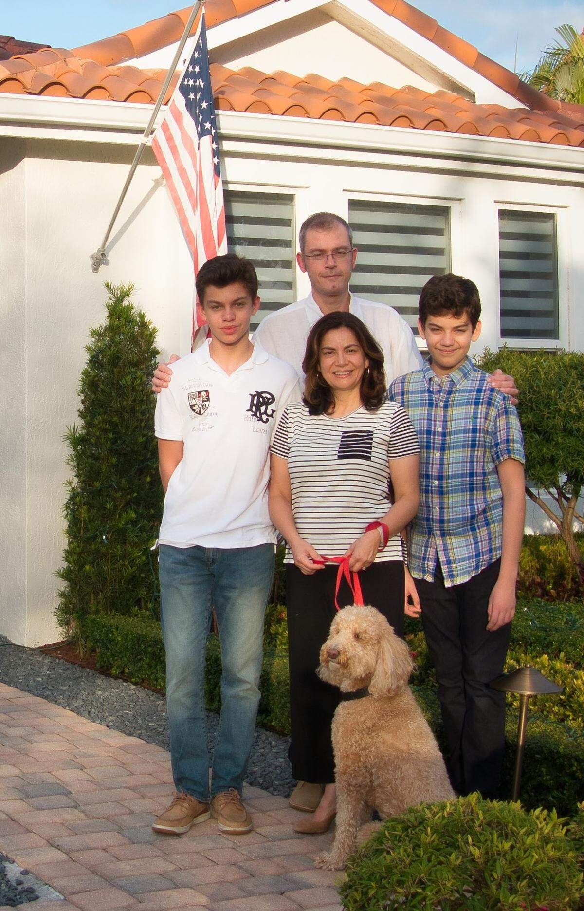 Dr. Gabriel Gavrilescu, chairman of medicine, Cleveland Clinic Weston, his wife, Dr. Adriana Rodriguez, a Cleveland Clinic Weston epileptologist, and their sons Gabriel Ignacio, on left, Lucas, on right, and their dog Scooby.