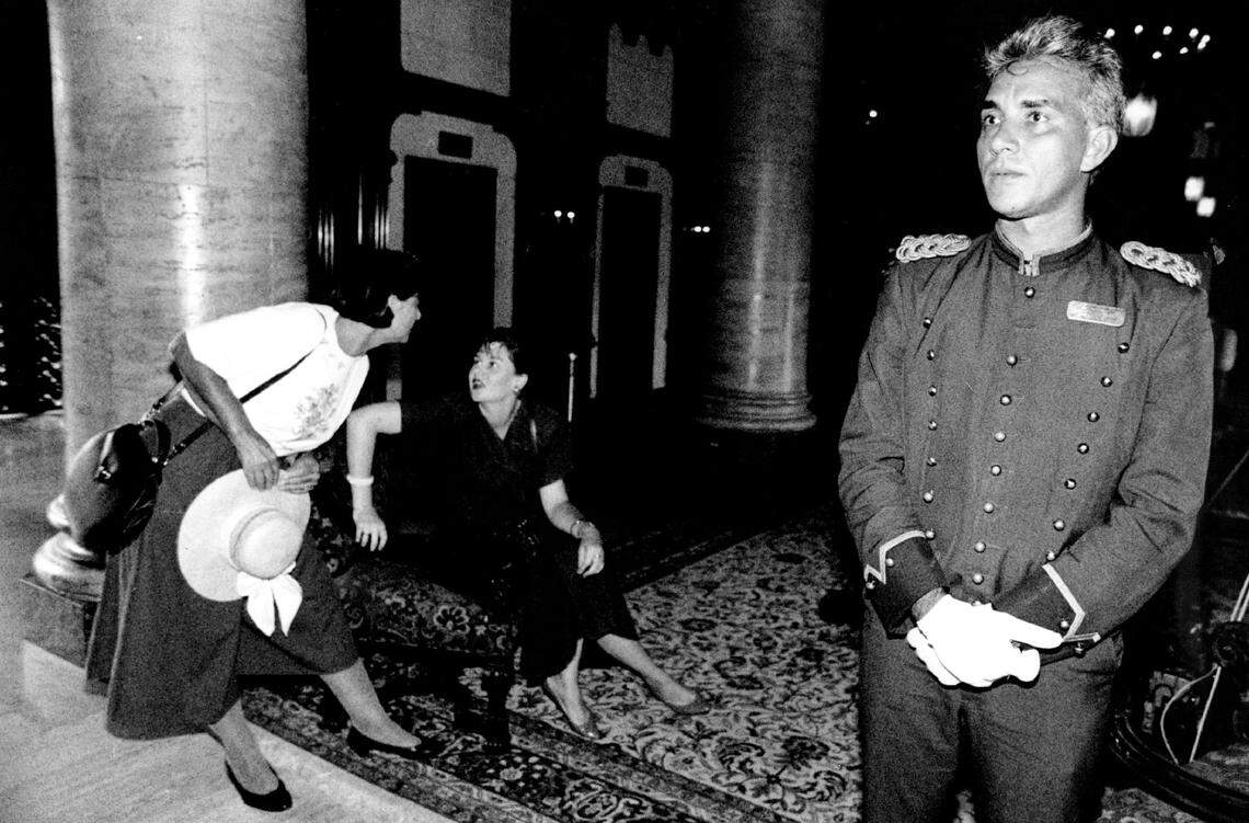 A bellhop stands guard in the lobby while guests leave the Biltmore in 1990.