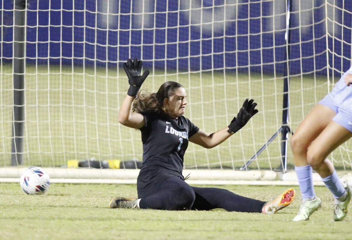 Lourdes Academy goalkeeper Sophia McMillian (1) fails to stop a goal during the Region 4-5A final against Pembroke Pines Charter in a girls’ soccer match Tuesday, Feb. 17, 2026, at Miami-Dade College’s Kendall Campus in Miami.