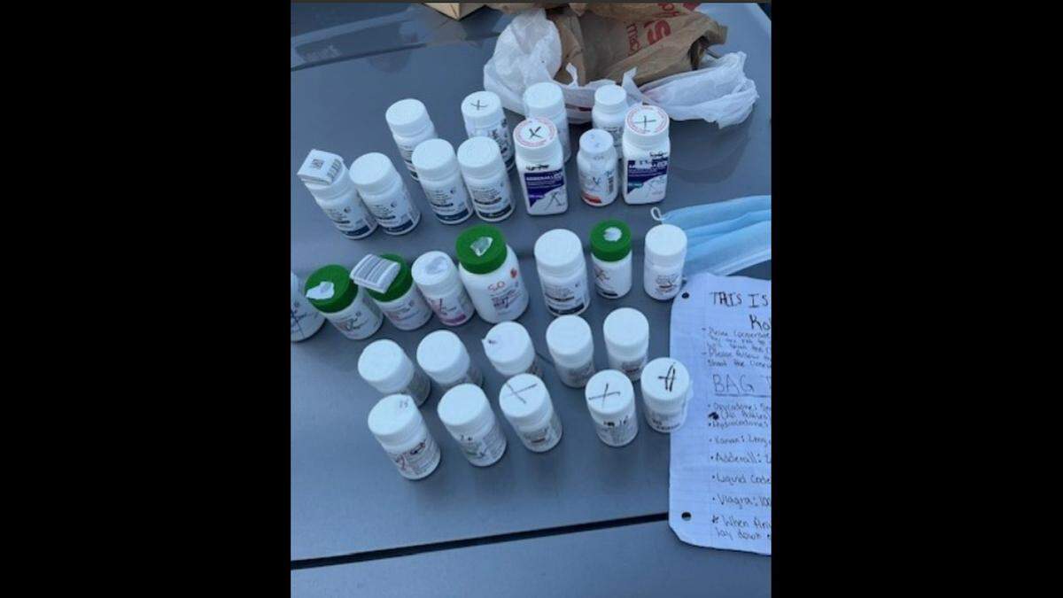 The suspect was arrested after a foot chase and police recovered nearly 30 bottles of medication, officials said.