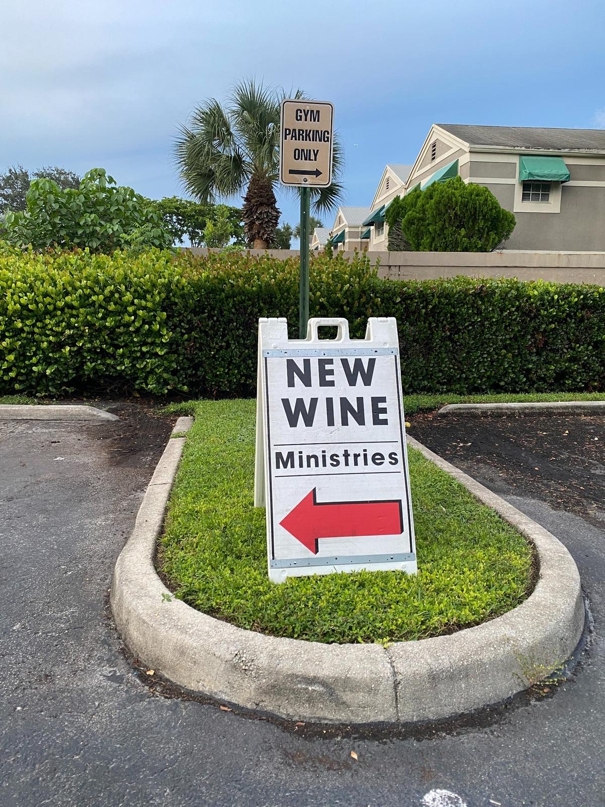 A sign found in the parking lot of New Wine Ministries directs traffic to the church on the night of a political and religious event that touted planned attendance by government leaders, candidates and pastors. New Wine’s lead pastor, Mario Bramnick, is a leader of the New Apostolic Reformation.