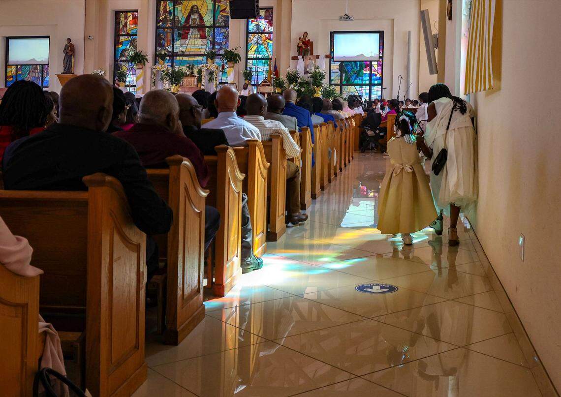 Dressed in their Easter outfits, congregants quietly make their way back to their seats as Little Haiti’s Notre Dame d’Haiti Catholic Church held its Easter Mass with prayers for Haiti on Easter Sunday, March 31, 2024, in Miami, Florida.