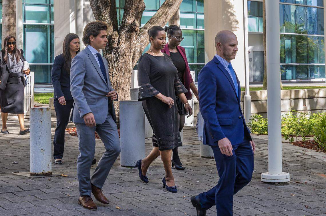 Officials with the U.S. Department of Justice and security personnel accompanied Martine Moïse (center), widow of Haitian President Jovenel Moïse and her daughter Jormalie Moïse (second from right) as they leave the Wilkie D. Ferguson Jr. U.S. Courthouse after testifying for the second day as the government’s first witness on Wednesday, March 11, 2026, in Miami. Federal prosecutors and defense lawyers delivered opening statements in the U.S. trial of four South Florida men charged in the assassination of Haiti’s president.