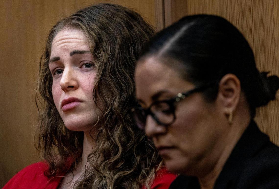 Miami, Florida, Feb. 1, 2024- With attorney Tara Kawass, right, by her side, Courtney Clenney, left, the OnlyFans model accused of killing her boyfriend, listens to arguments during a hearing before judge Laura Shearon Cruz at the Miami Dade Criminal Courthouse 1350 NW 12th Ave Miami