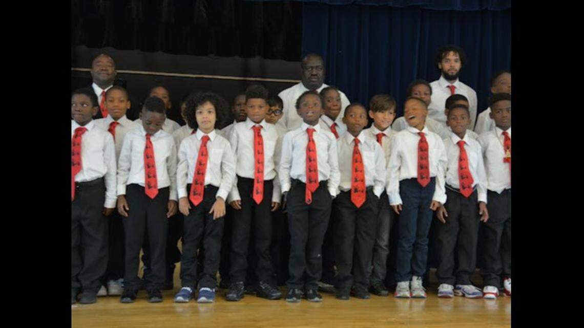 Holmes Elementary School math teacher Abe Coleman with some of the students he had mentored as part of his leadership role with the 5000 Role Models of Excellence Program at the Liberty City School.