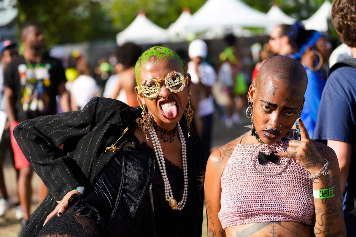 Two festival attendees pose for the camera at AFROPUNK Brooklyn.