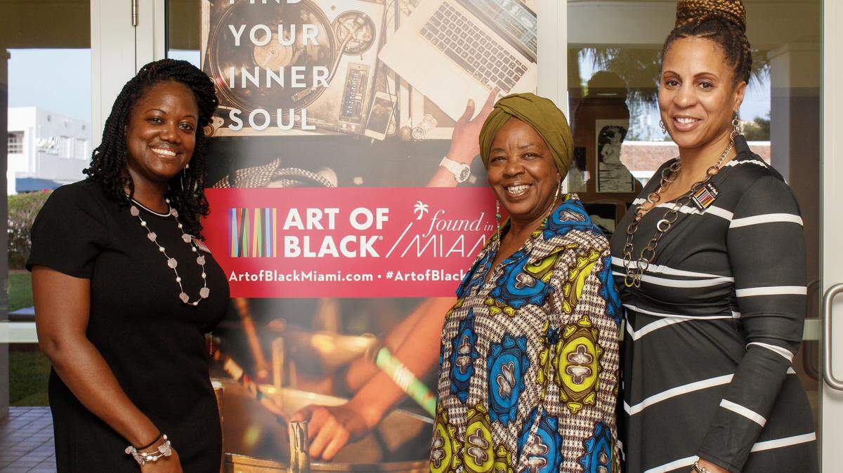 Petra Brennan, Carole Ann Taylor and Connie Kinnard, all with the Greater Miami Convention and Visitors Bureau, at the Art of Black Miami event at the Koubek Center in LIttle Havana.