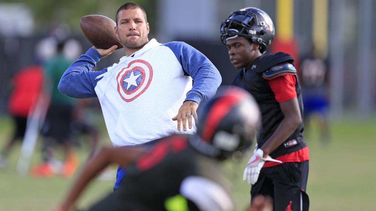 Coach Nick Turnbull throws during drills at Miami Christian School on Wednesday, Oct. 17, 2018.