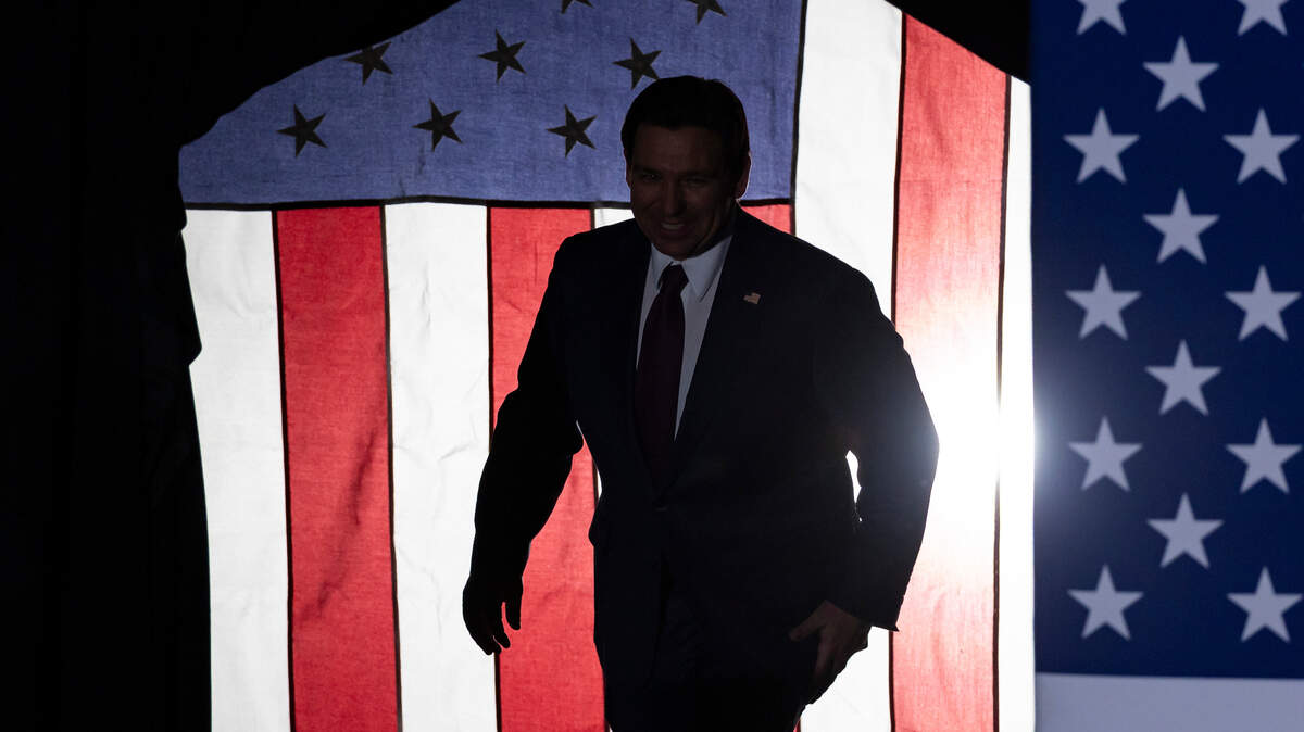 Florida Gov. Ron DeSantis arrives at his caucus watch party in Iowa.