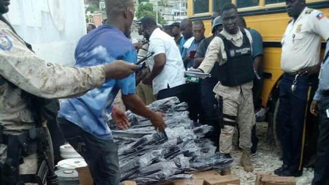 Junior Joseph was found guilty on Friday of conspiring to illegally export guns and ammunition to Haiti. This photo of Haitian agents seizing the weapons was an exhibit in the trial.