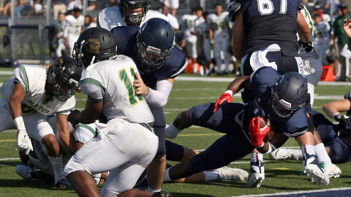 Henry Parrish Jr., right, rushes for the touchdown in first half during the Columbus High football team season opener against Mater Academy at Columbus High School on Thursday, August 23, 2018.