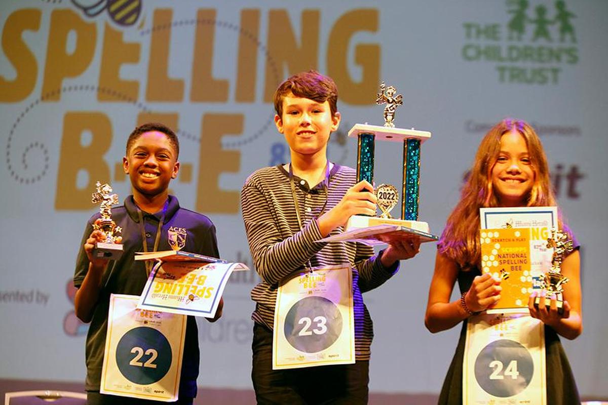 The three winners of the Miami Herald Spelling Bee for Miami-Dade and Monroe students: from left, Aventura City of Excellence School sixth-grader James Reese, 11, who came in third; winner Juan Cristóbal Rondeau, 13, a seventh-grader at Westminster Christian; and Isabella Velasquez, 11, a fifth-grader at South Pointe Elementary, who placed second. The Bee was held Thursday, March 17, 2022, at Charles F. Dodge City Center in Pembroke Pines.