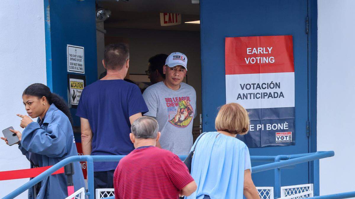 A voters exit Miami City Hall after casting their early vote in Miami, Florida on Sunday, November 2, 2025.
