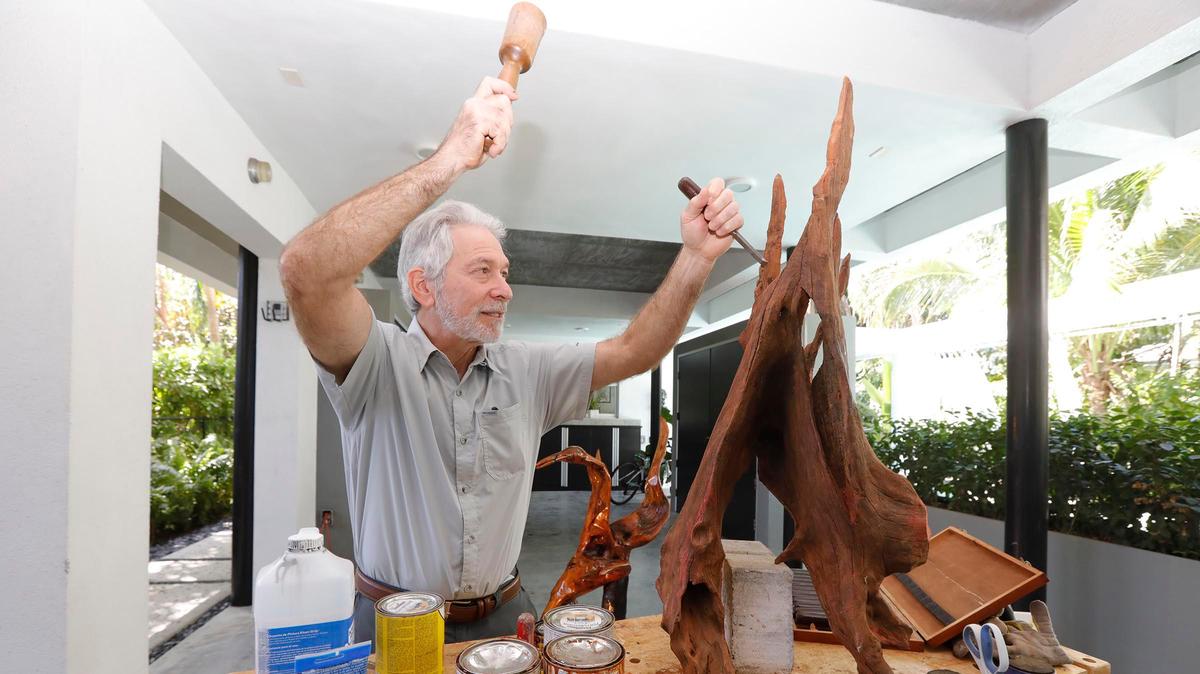 Dr. Robert Udelsman, chief of endocrine surgery at Miami Cancer Institute at Baptist Health South Florida, sculpts in his Coral Gables home garage studio.