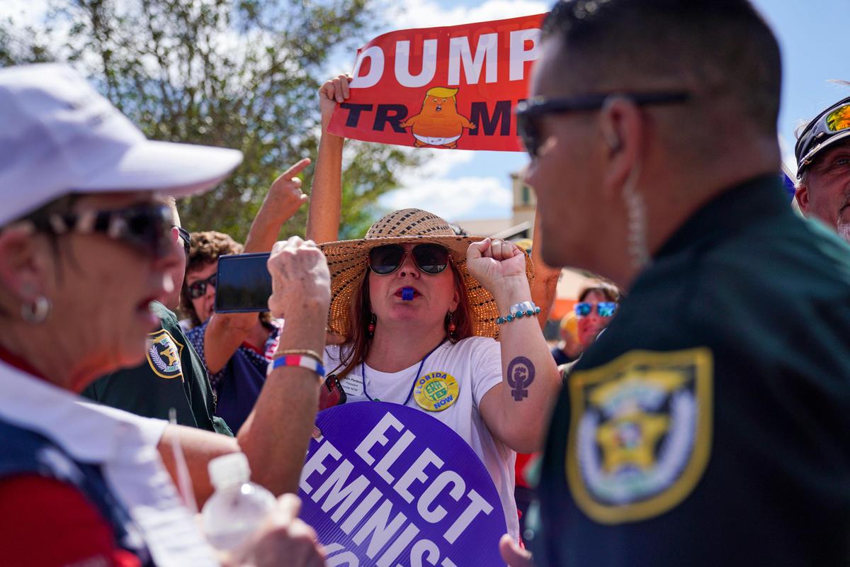 Kim Porteous, Florida Now president, blows a whistle during President Donald Trump’s speech at the Sharon L. Morse Performing Arts Center on Thursday, Oct. 3, 2019 in The Villages.