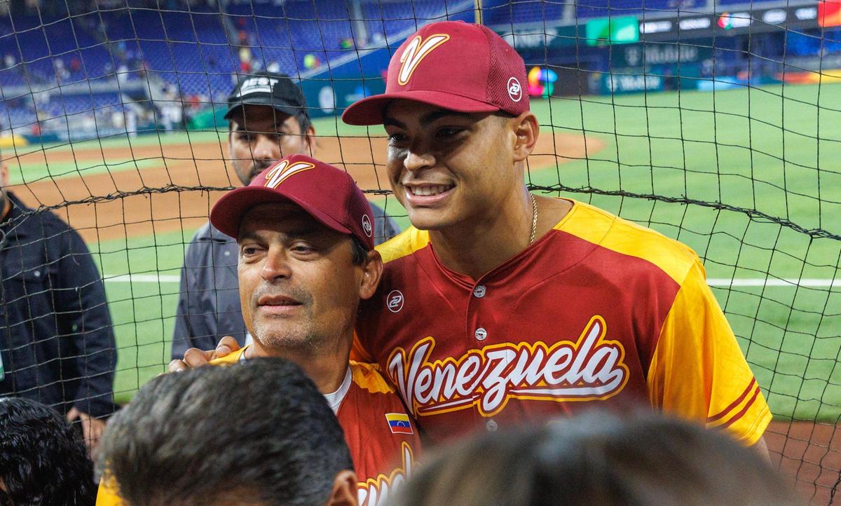 Venezuela starting pitcher Jesus Luzardo (44) poses for the picture with his father Jesus Sr. after the Pool D game against Israel at the World Baseball Classic at loanDepot Park on Wednesday, March 15, 2023, in Miami, Fla.