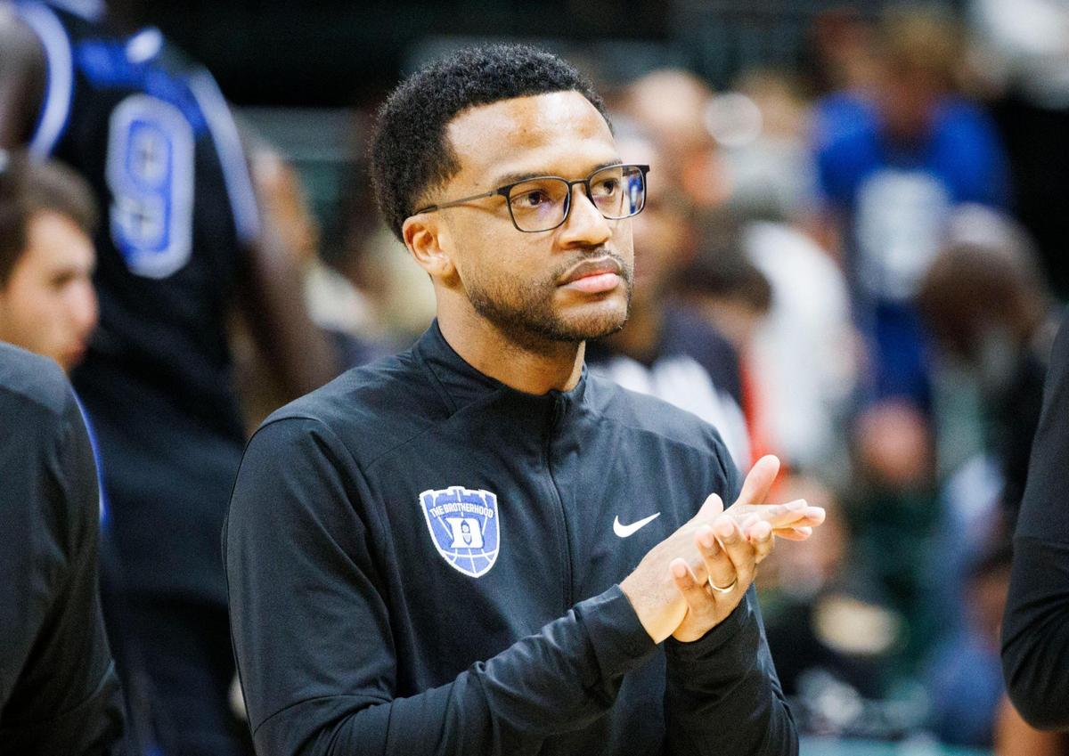 Jai Lucas, current Duke University Assistant Basketball Coach, and new Miami Hurricanes Head Coach, claps for his players before the first half of a game on Tuesday, Feb. 25, 2025, at Watsco Center in Coral Gables, Fla.
