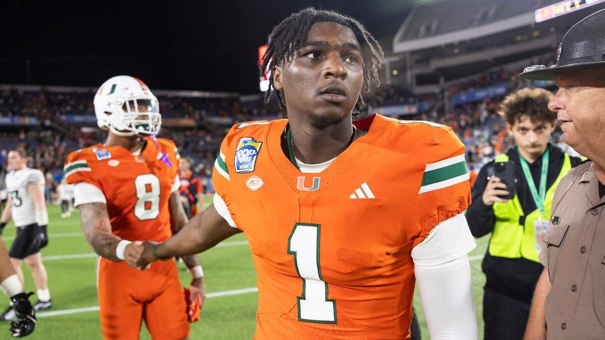 Miami Hurricanes quarterback Cam Ward (1) looks on from the field after losing to Iowa State Cyclones in their Pop-Tarts Bowl football game at the Camping World Stadium on Saturday, Dec. 28, 2024, in Orlando, Fla.
