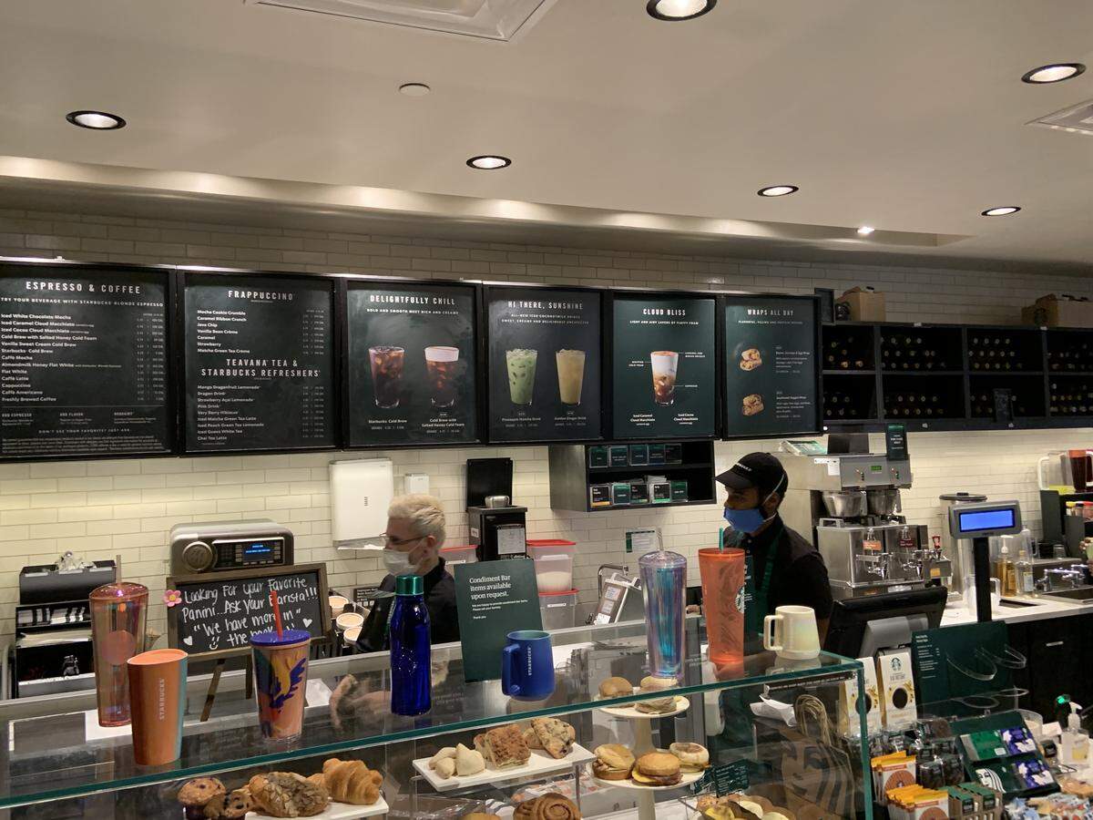Photos taken around 12:30 p.m. Friday show some Starbucks employees wearing a mask that only partially covers their face. This Starbucks is located on the Jackson Memorial Hospital campus.