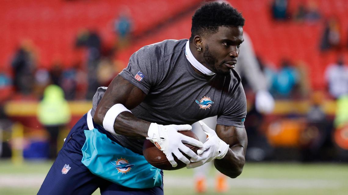 Miami Dolphins wide receiver Tyreek Hill (10) runs during pregame warmups before an NFL wild-card playoff football game against the Kansas City Chiefs at GEHA Field at Arrowhead Stadium in Kansas City, Missouri, on Saturday, January 13, 2024.