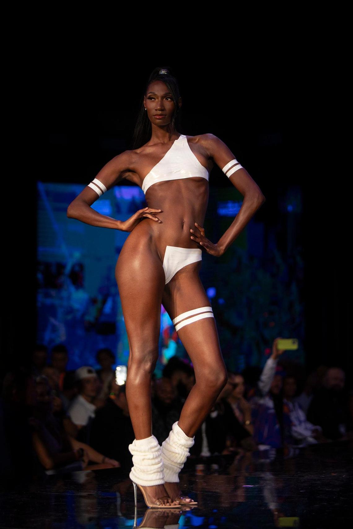 The designer , Drakhan Blackhart, the King of Tape, designs swimsuits in tape on model bodies during Miami Swim Week at M2 Club, South Beach on Sunday June 3rd., 2024.