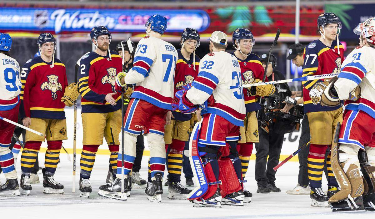 The Florida Panthers and the New York Rangers shake hands after their Winter Classic outdoor hockey game at loanDepot park on Friday, Jan. 2, 2026, in Miami, Fla. The Rangers defeated the Panthers.