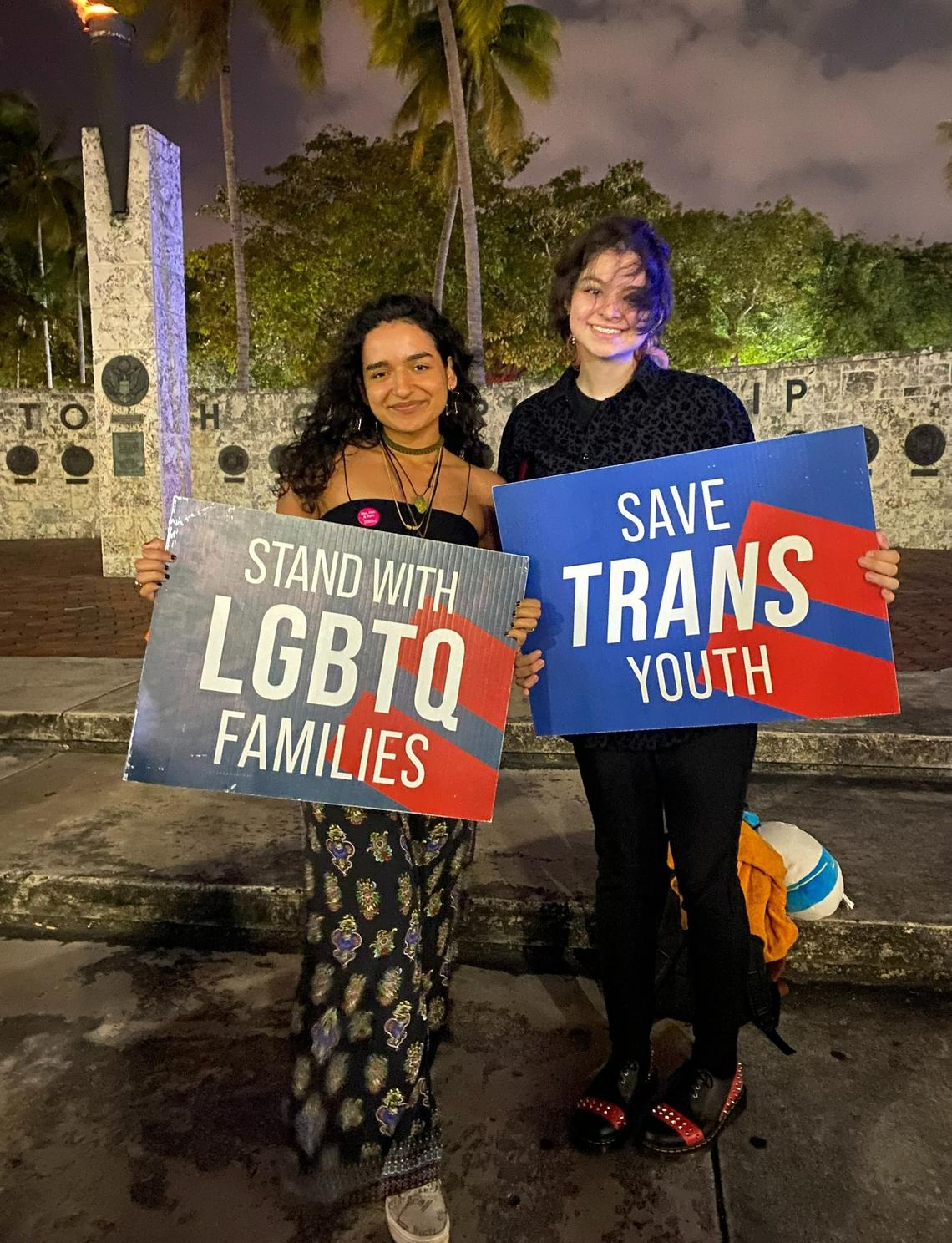 Nathalie Saladrigas, 19, left, and Felix Francis, 23, at the Torch of Friendship in Miami before heading to Tallahassee Sunday night to protest the ‘Don’t Say Gay’ bill at the Capitol Monday.