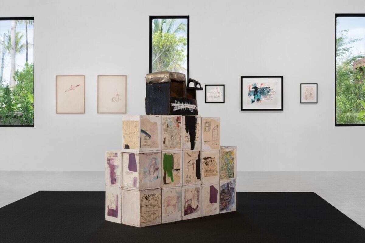 “Brain,” 1985, is among the most structurally inventive works in the exhibition: a three-dimensional sculpture assembling Xerox paper collage, acrylic, and oilstick across 27 individually painted wood blocks mounted on a bootblack stand,