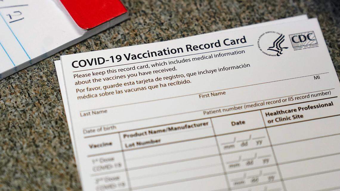 In this photo, a real COVID-19 vaccination record card is pictured. A nurse and her two daughters used fake COVID-19 vaccine cards to “maintain and obtain” work at a nursing home in the village of Croton-on-Hudson, officials say.
