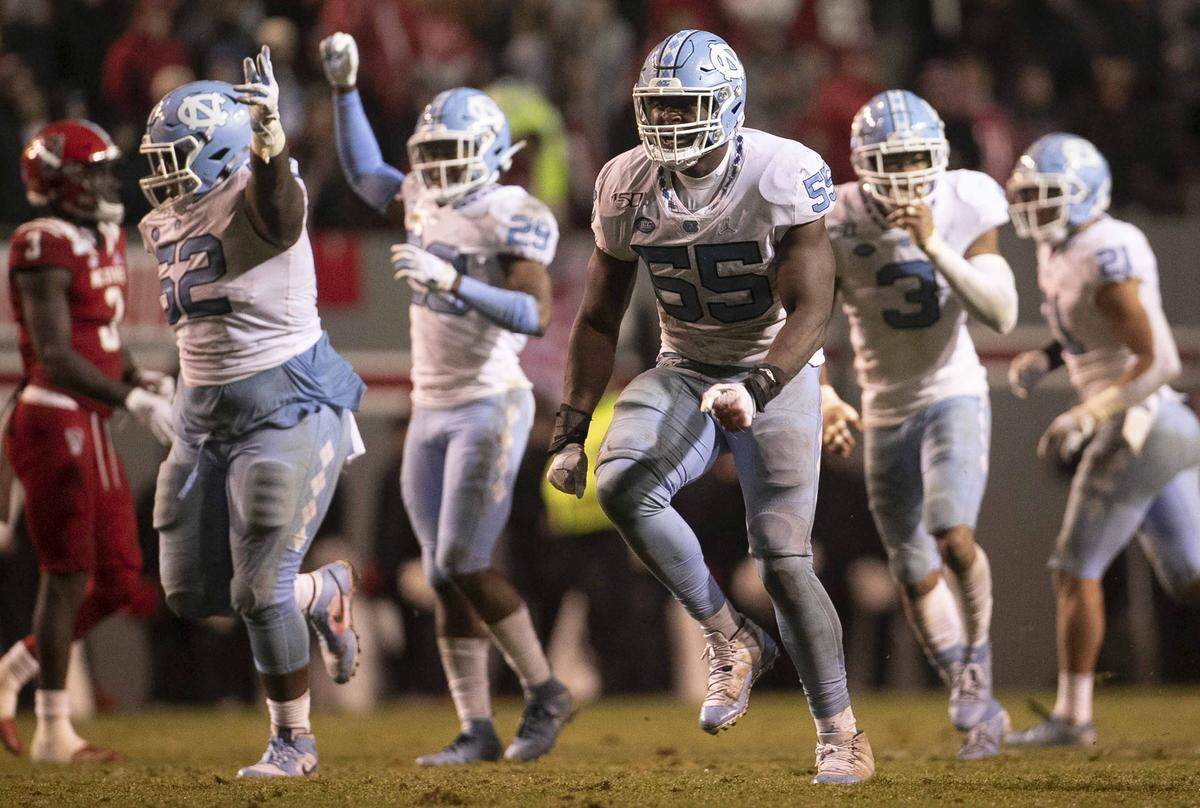 North Carolina’s Jason Strowbridge (55) celebrates after a fumble recovery by teammate Jeremiah Gemmel in the third quarter on Saturday, November 30, 2019 at Carter-Finley Stadium in Raleigh, N.C.
