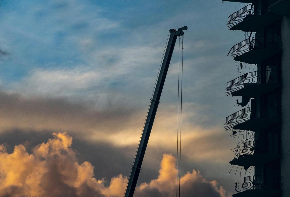 Miami-Dade County Fire Rescue crews uses heavy machinery early Saturday morning as the search and rescue continue at the Champlain Towers South Condo, located at 8777 Collins Avenue in Surfside, that collapsed Thursday morning, on Saturday, June 26, 2021.