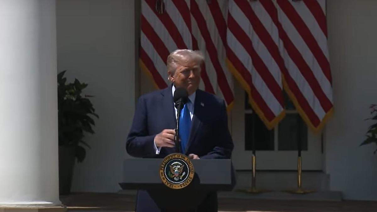 President Donald Trump speaks to a crowd outside The White House on May 1 during a National Day of Prayer event.