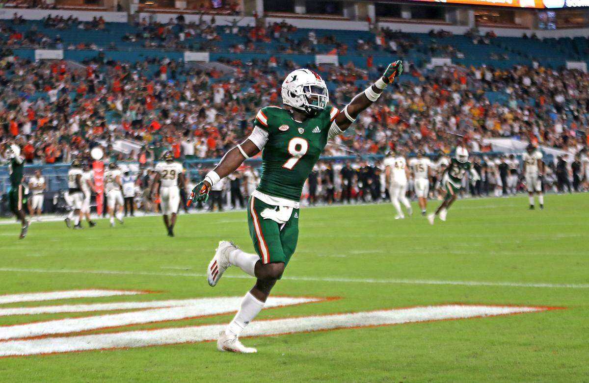 Miami Hurricanes linebacker Avery Huff (9) celebrates after safety against the Appalachian State Mountaineers during the first quarter of their ACC football game at Hard Rock Stadium on Saturday, September 11, 2021 in Miami Gardens, Florida.