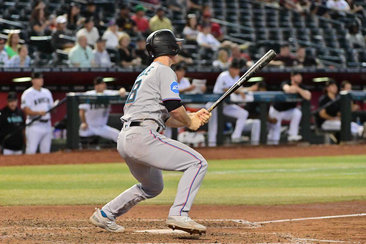 Miami Marlins shortstop Joey Wendle (18) hits an RBI double in the ninth inning against the Arizona Diamondbacks at Chase Field on Wednesday, May 10, 2023.