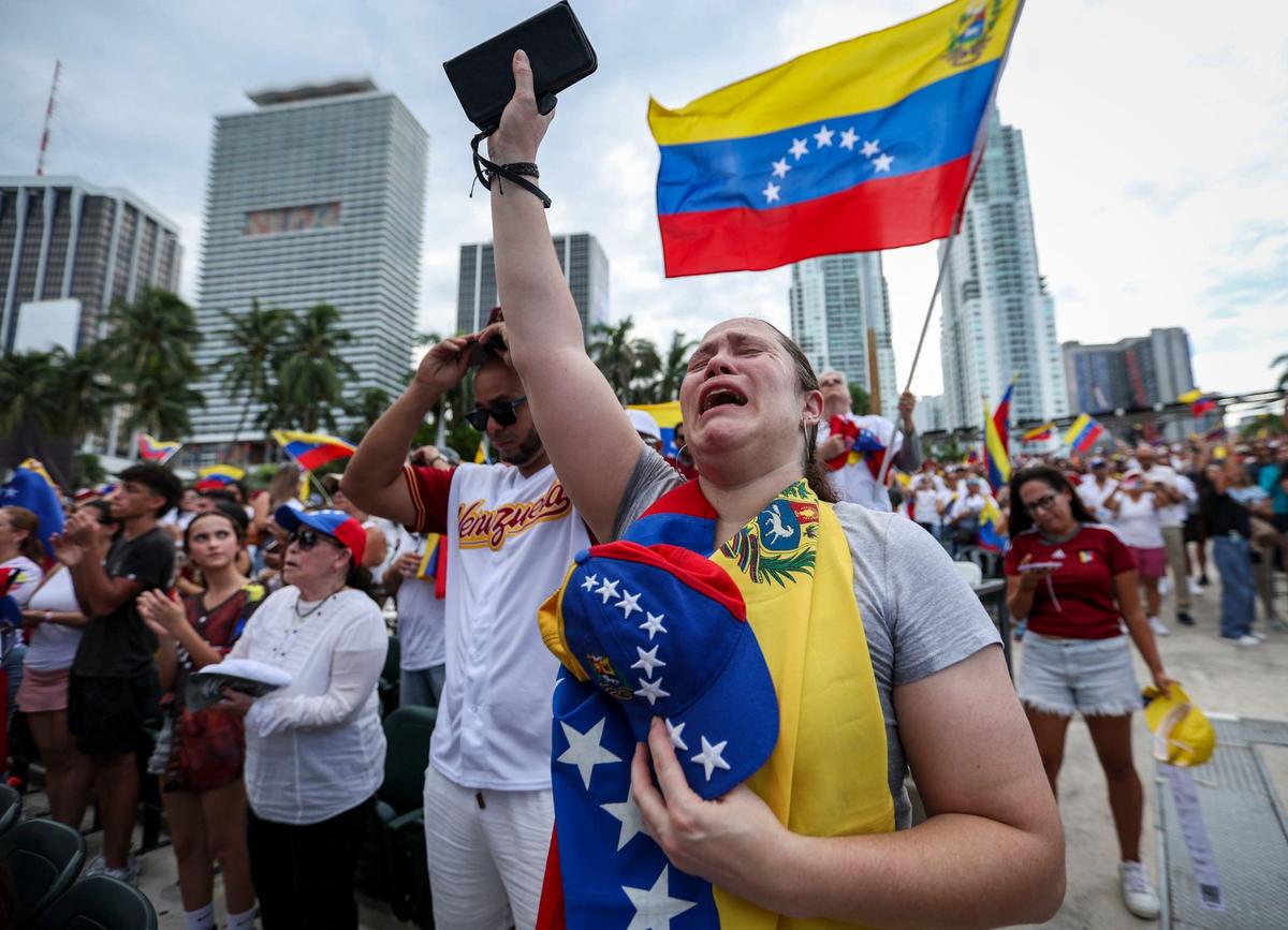 Blanca Solorzano weeps after having sung Venezuela’s national anthem at a rally at Bayfront Park in downtown Miami, Fla. The rally was held in opposition of Venezuelan strongman Nicolás Maduro and what many in the international community believe was a rigged election.