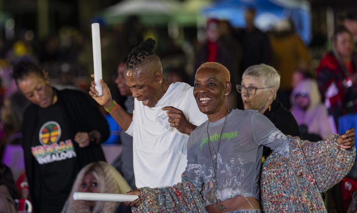 Donna Fearon, right, and Claude Wilson dance as they attend the Reggae Genealogy music festival at Volunteer Park on Saturday, Feb. 7, 2026, in Plantation, Fla.