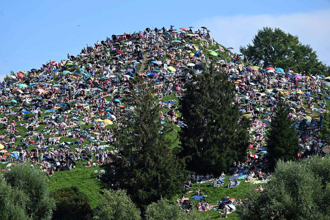 On July, 27, 2024, in Bavaria, Munich, fans sit on the Olympiaberg in the Olympiapark and wait in the sunshine for the Taylor Swift concert to begin. Taylor Swift’s first of two concerts in Munich as part of her “The Eras Tour” took place there as fans partaked in Taylor-Gating.
