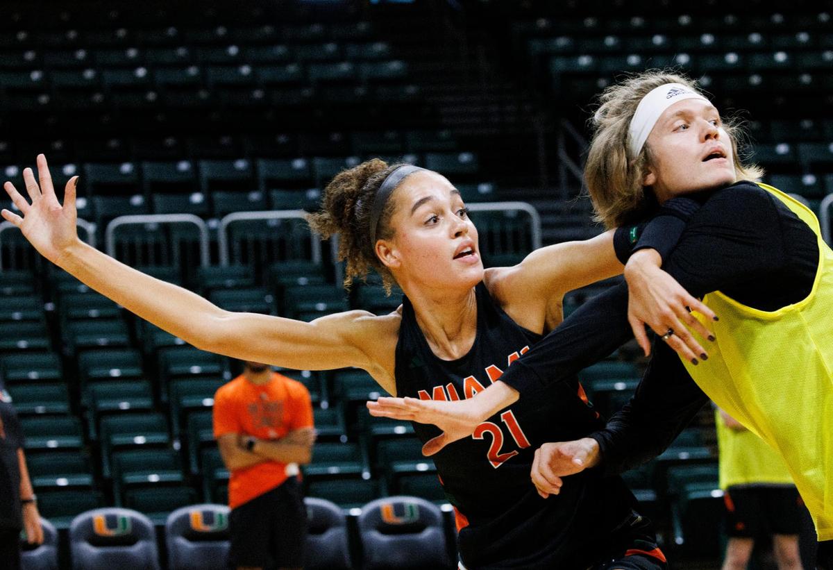 Natalija Marshall (21) signals to her teammate to pass her the ball during practice following media day for women’s basketball on Monday, Oct. 21, 2024, at the University of Miami.