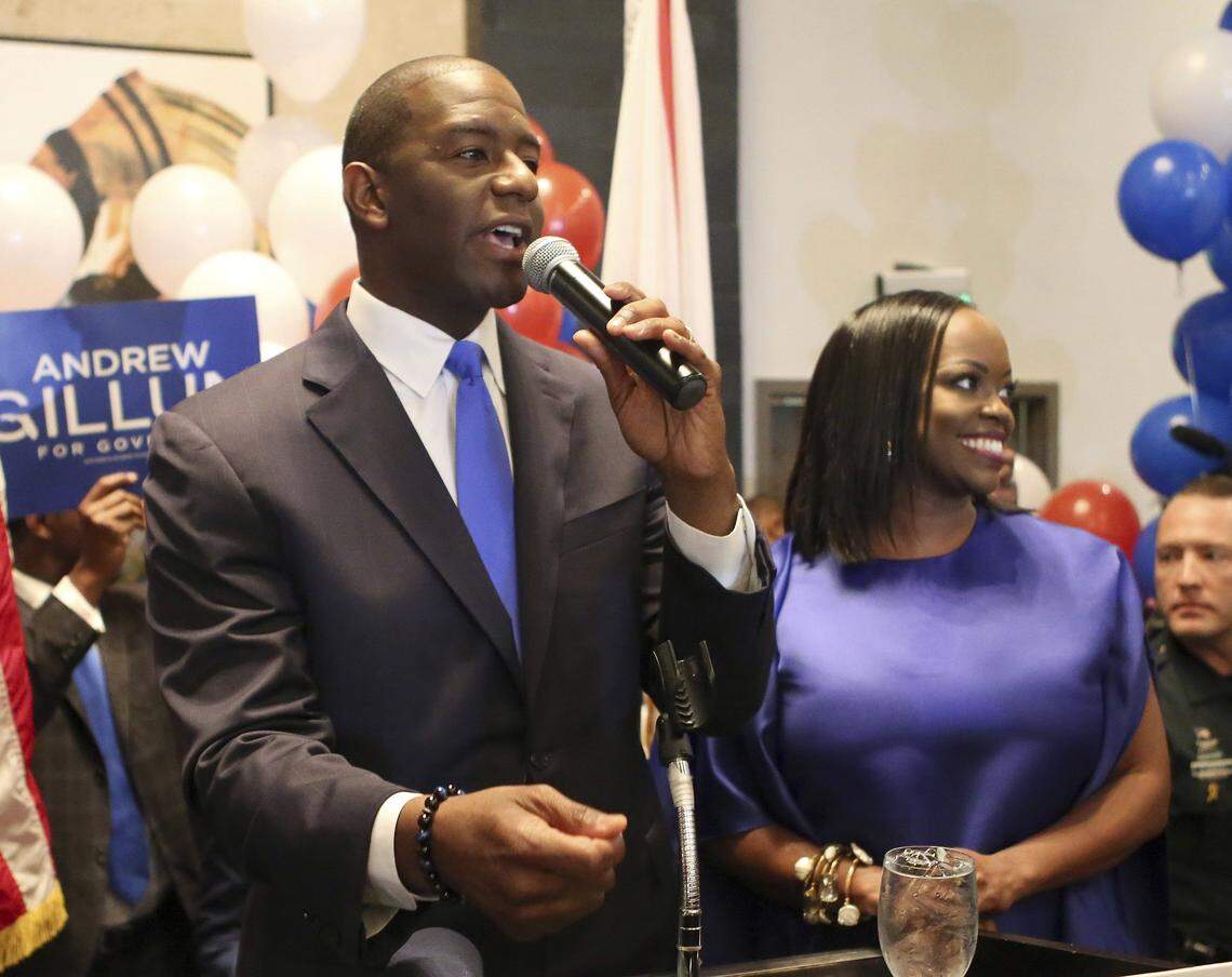 Andrew Gillum, with his wife, R. Jai Gillum, addresses his supporters after winning the Democratic primary for governor on Tuesday, Aug. 28, 2018, in Tallahassee.