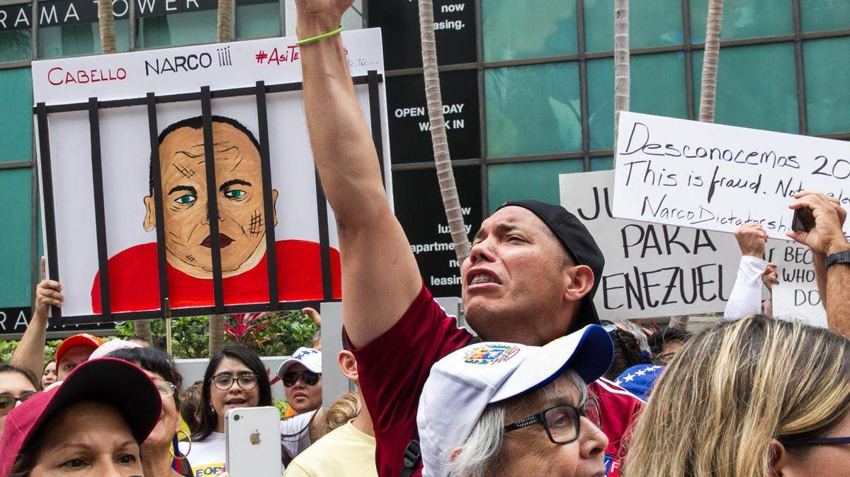 Marcos Carbono, along with hundreds of Venezuelan exiles in Miami, protest the presidential election in Venezuela at the Venezuelan consulate on Brickell Avenue on Sunday, May 20, 2018.