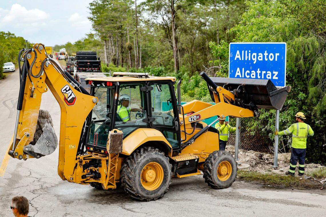 Workers install a permanent Alligator Alcatraz sign. The facility is within the Florida Everglades, 36 miles west of the central business district of Miami, in Collier County, Florida. , Florida, on Thursday, July 3, 2025.