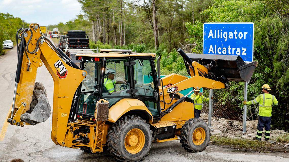 Workers install a permanent Alligator Alcatraz sign. The facility is within the Florida Everglades, 36 miles west of the central business district of Miami, in Collier County, Florida. , Florida, on Thursday, July 3, 2025.