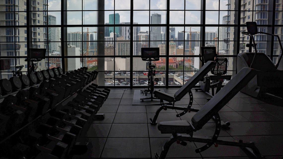 Guests and residents have a panoramic view of the downtown skyline as they workout in the large gym at the soon-to-open Gale Hotel and Residence during a recent property preview on Thursday, May 16, 2024 in Miami, Florida.