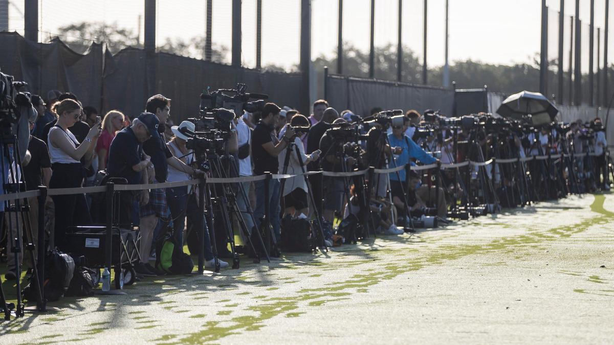 Members of the media prepare to capture images of Inter Miami’s first practice with their team’s new forward Lionel Messi (10) and midfielder Sergio Busquets (5) at the Florida Blue Training Center on Tuesday, July 18, 2023, in Fort Lauderdale, Fla.
